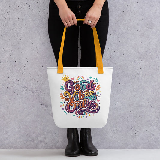 tote bag with 'Good Vibes Only' groovy text, rainbows, and smiling sun in a vibrant 70s psychedelic style.