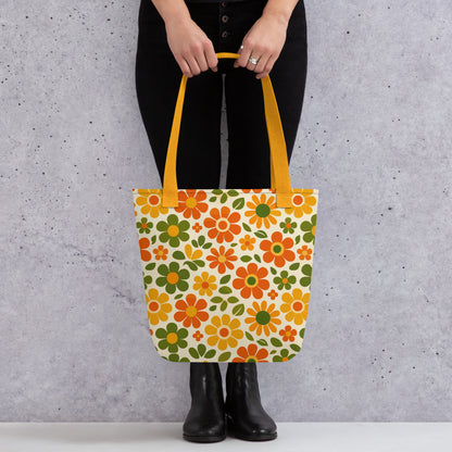 Vibrant 1970s retro flower power pattern printed on a polyester tote bag with groovy orange and yellow daisy graphics.