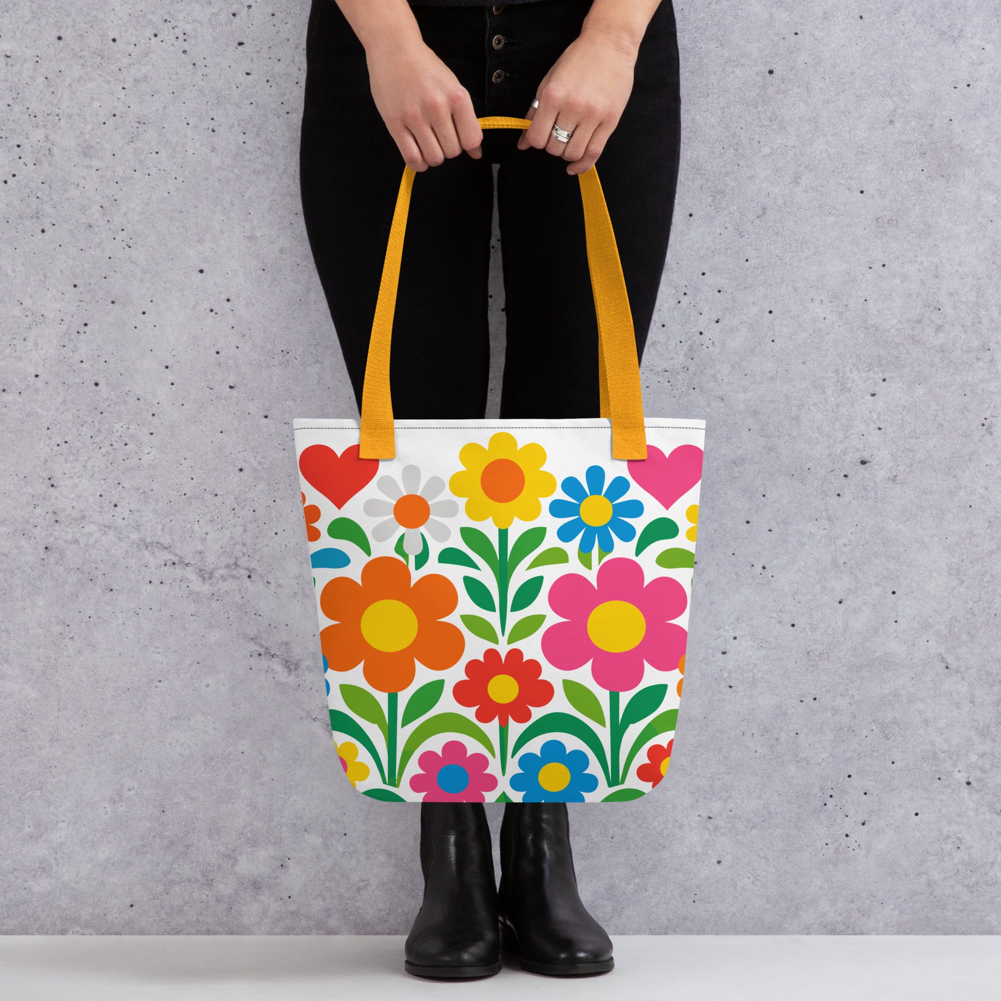 Vibrant 70s style retro flower power design with colorful daisies and hearts printed on a white tote bag. faroutgoods.