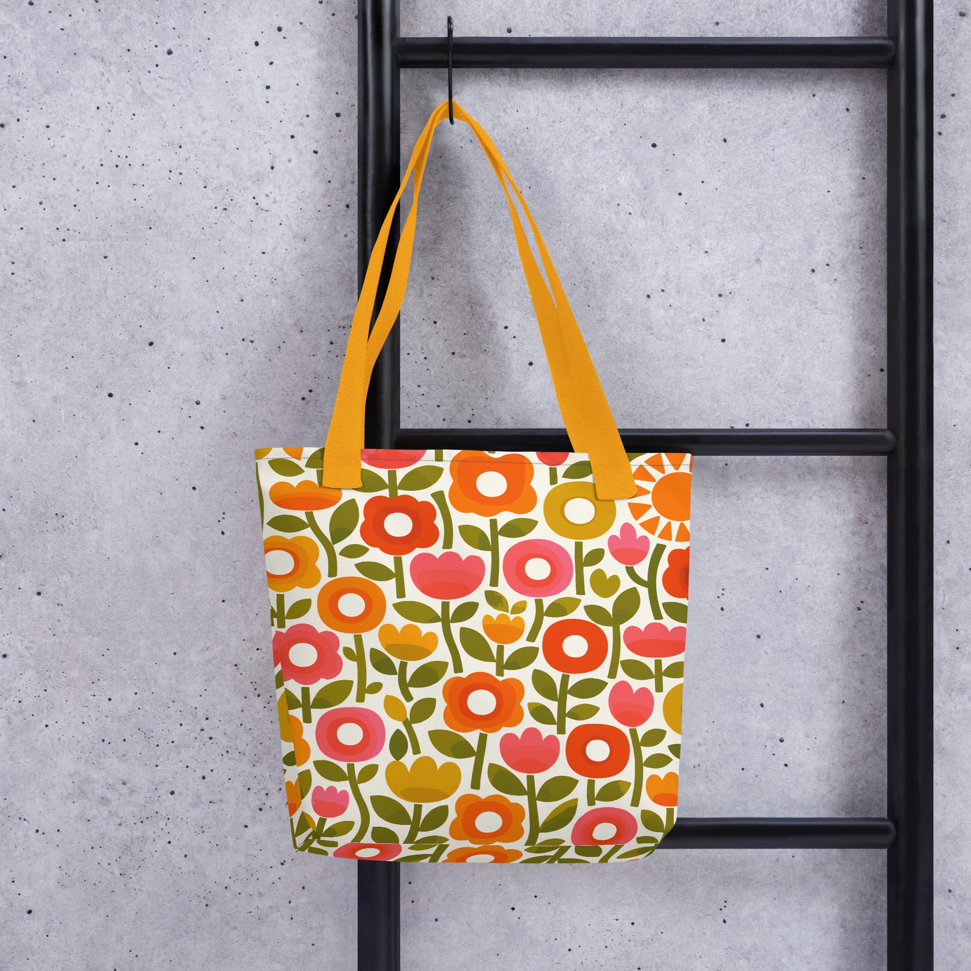 Retro 1970s flower power pattern tote bag featuring geometric orange, pink, and yellow flowers with green leaves