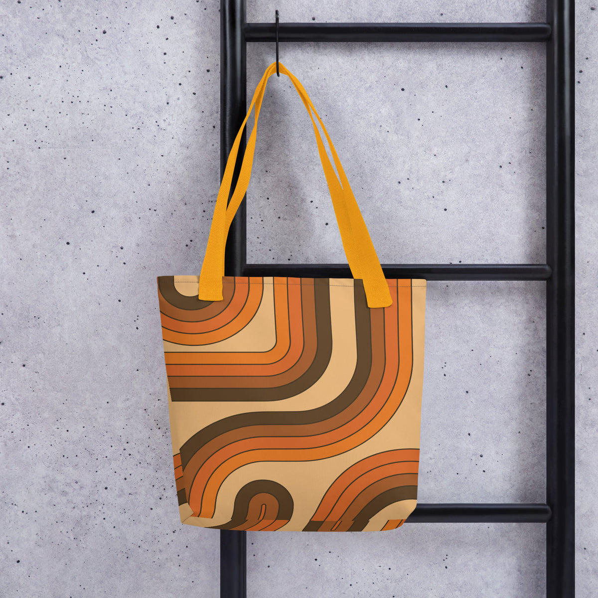 Retro 70s curved stripe pattern in earth tones, brown, and orange printed on a durable polyester everyday tote bag.