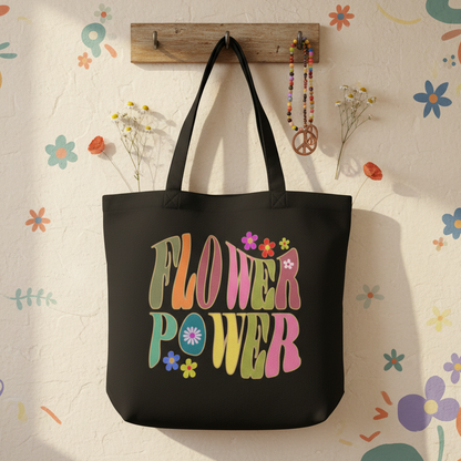 Sustainable eco tote bag featuring a vibrant 70s retro flower power pattern with orange and yellow floral designs.