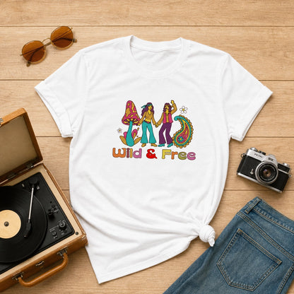 Front of a vintage-style unisex t-shirt featuring a colorful "Wild and Free" graphic with retro flowers and 70s typography.