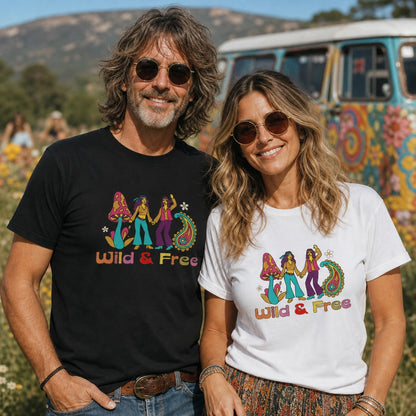 Front of a vintage-style unisex t-shirt featuring a colorful "Wild and Free" graphic with retro flowers and 70s typography.