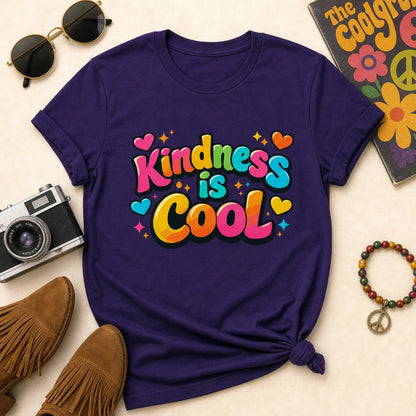 Vibrant "Kindness is Cool" typography design with colorful bubble letters, hearts, and stars on a black background.
