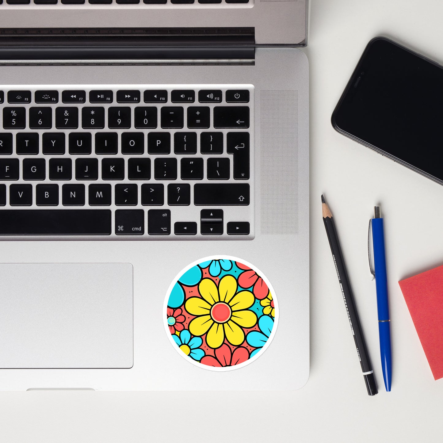 Colorful retro 60s style flower power floral pattern sticker with blue, yellow, and red blossoms.