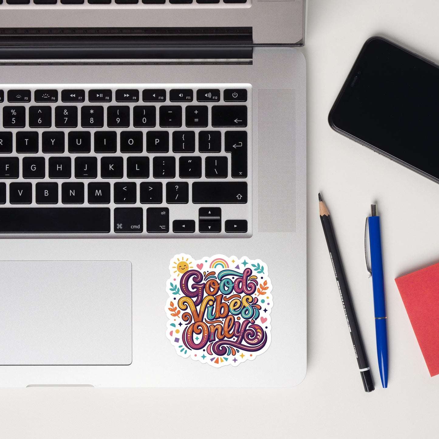 Colorful retro sticker with 'Good Vibes Only' text, rainbow, sun, and stars in a 70s psychedelic art style.