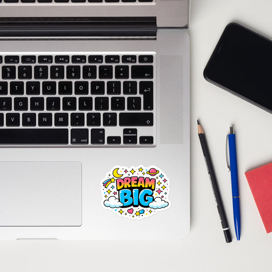 Dream Big, text surrounded by yellow stars, a pink planet, and white clouds on a black background.