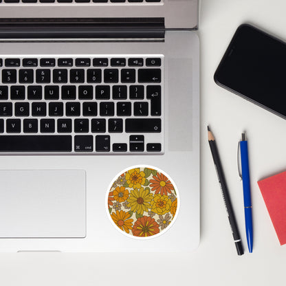 A seamless retro groovy floral pattern with orange, yellow, and cream daisy blooms