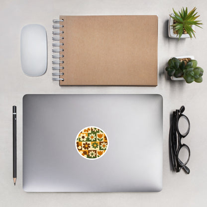 Durable vinyl sticker featuring a 1970s retro floral grid pattern with groovy flowers in orange, brown, and green.