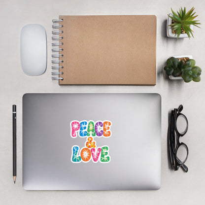 Colorful tie-dye Peace and Love lettering vinyl sticker in retro 60s and 70s vibrant rainbow font. Faroutgoods