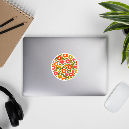 Retro 1970s flower power pattern vinyl sticker featuring geometric orange, pink, and yellow flowers with green leaves