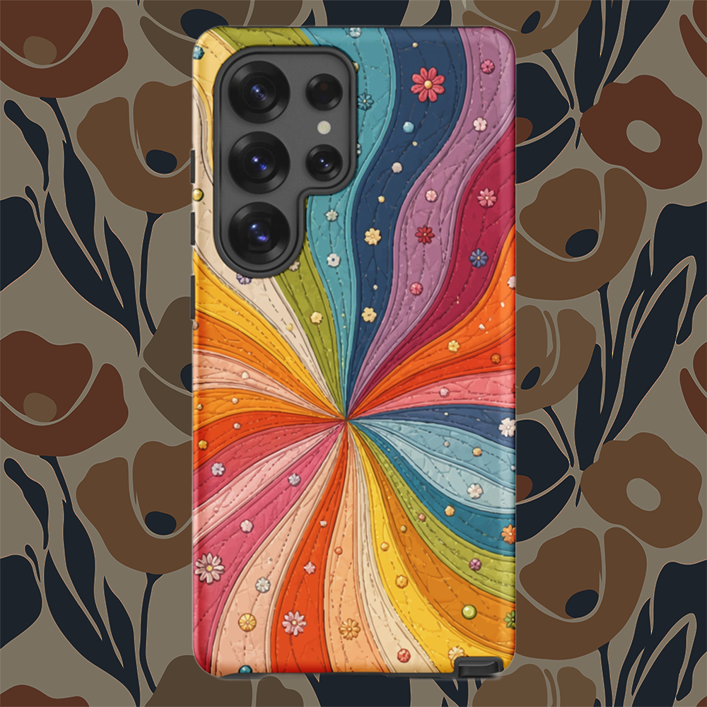 Flexible TPU Samsung Galaxy case featuring a vibrant retro 70s quilted rainbow swirl design with stitching and tiny flowers.