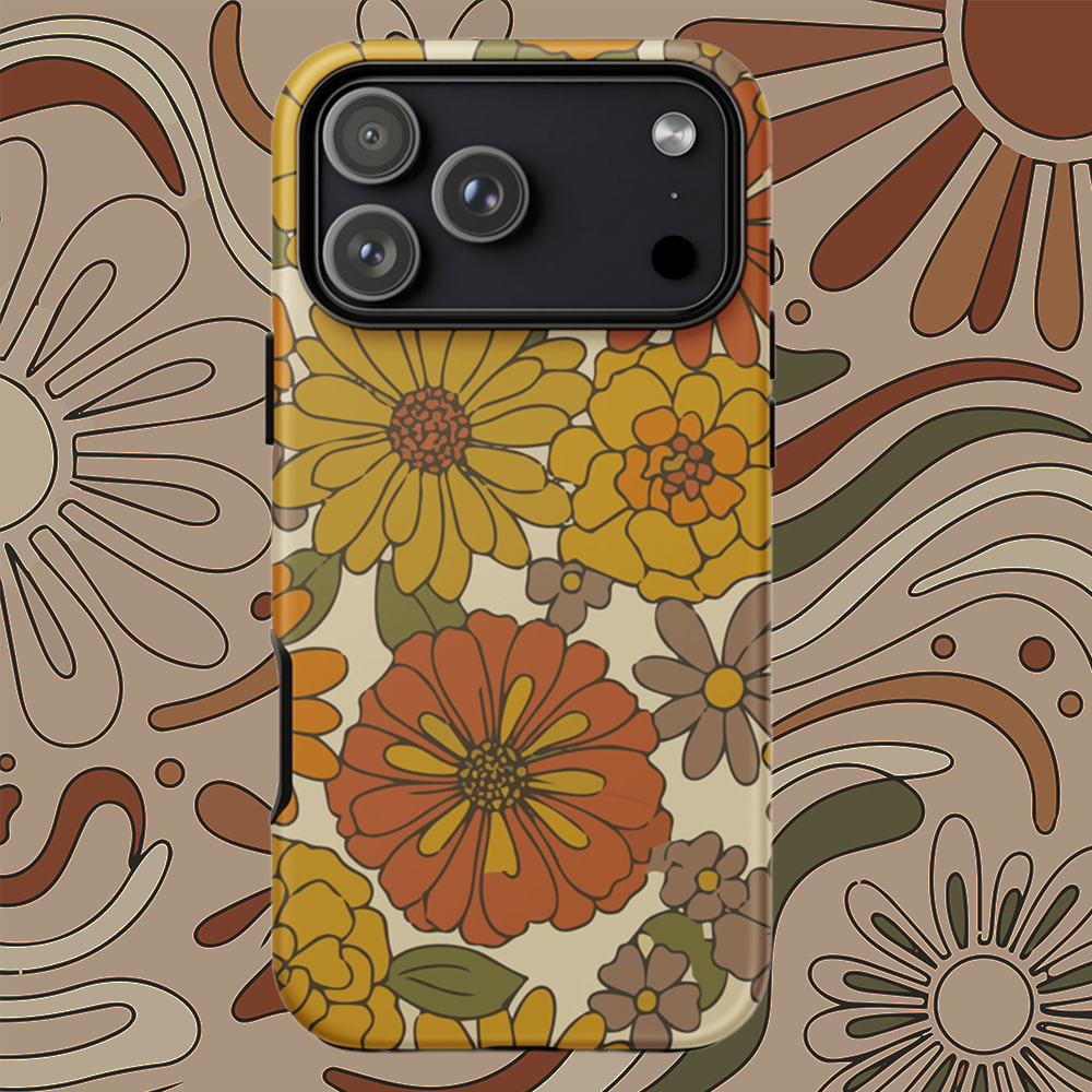 A flexible TPU iPhone case featuring a seamless retro groovy floral pattern with warm orange, yellow, and cream daisies.