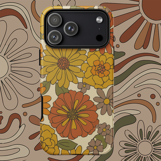 A flexible TPU iPhone case featuring a seamless retro groovy floral pattern with warm orange, yellow, and cream daisies.