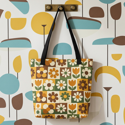 Polyester tote bag featuring a 70s retro floral tile pattern in orange, brown, and green from Far Out Goods.