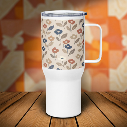 Stainless steel travel mug with a large handle featuring a 70s-style floral pattern in muted earth tones of terracotta, sage green, and mustard yellow.