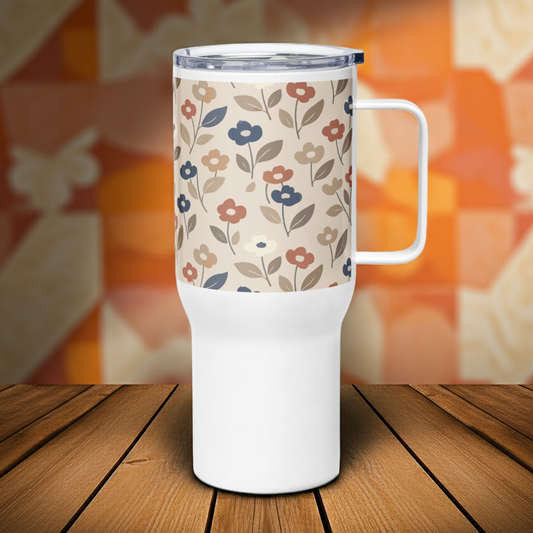 Stainless steel travel mug with a large handle featuring a 70s-style floral pattern in muted earth tones of terracotta, sage green, and mustard yellow.
