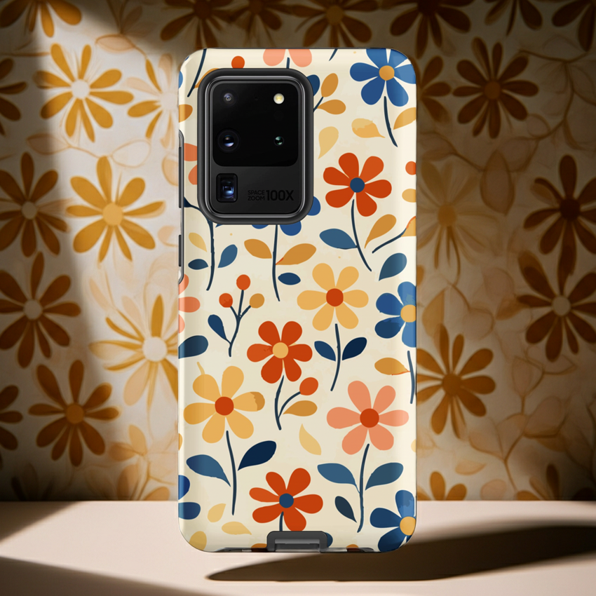 Protective Samsung phone case featuring a Groovy Retro Bloom floral pattern with pink, orange, and yellow 70s-style flowers on a tough, glossy shell.