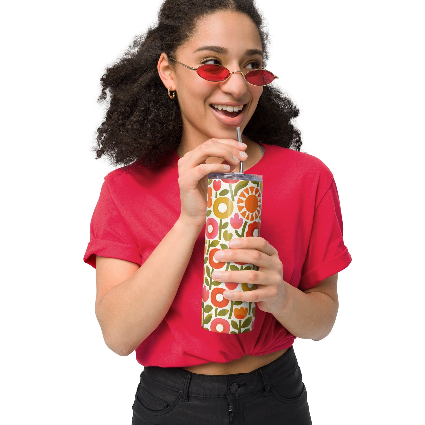 Retro 1970s flower power pattern travel tumbler featuring geometric orange, pink, and yellow flowers with green leaves
