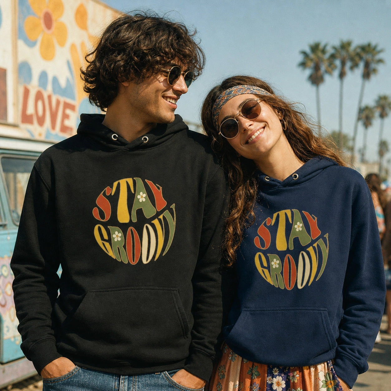 Unisex hoodie featuring a "Stay Groovy" vintage 70s floral design with vibrant orange and yellow flowers on a soft fabric base.