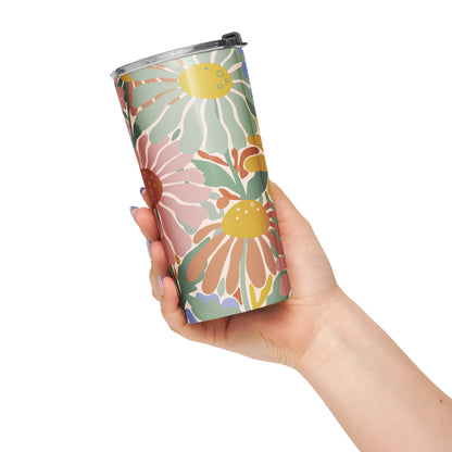 Retro 70s style flower power pattern with pink, green, and orange daisies on a bohemian insulated travel mug tumbler.