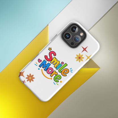 Smile More, bubbly lettering with a yellow sun-smile and pink heart on a black protective iPhone case