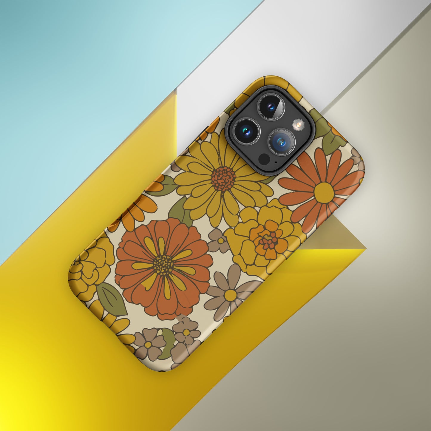 A flexible TPU iPhone case featuring a seamless retro groovy floral pattern with warm orange, yellow, and cream daisies.
