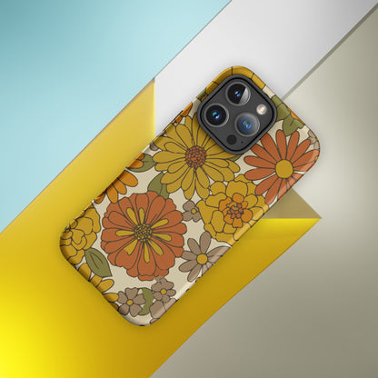 A flexible TPU iPhone case featuring a seamless retro groovy floral pattern with warm orange, yellow, and cream daisies.