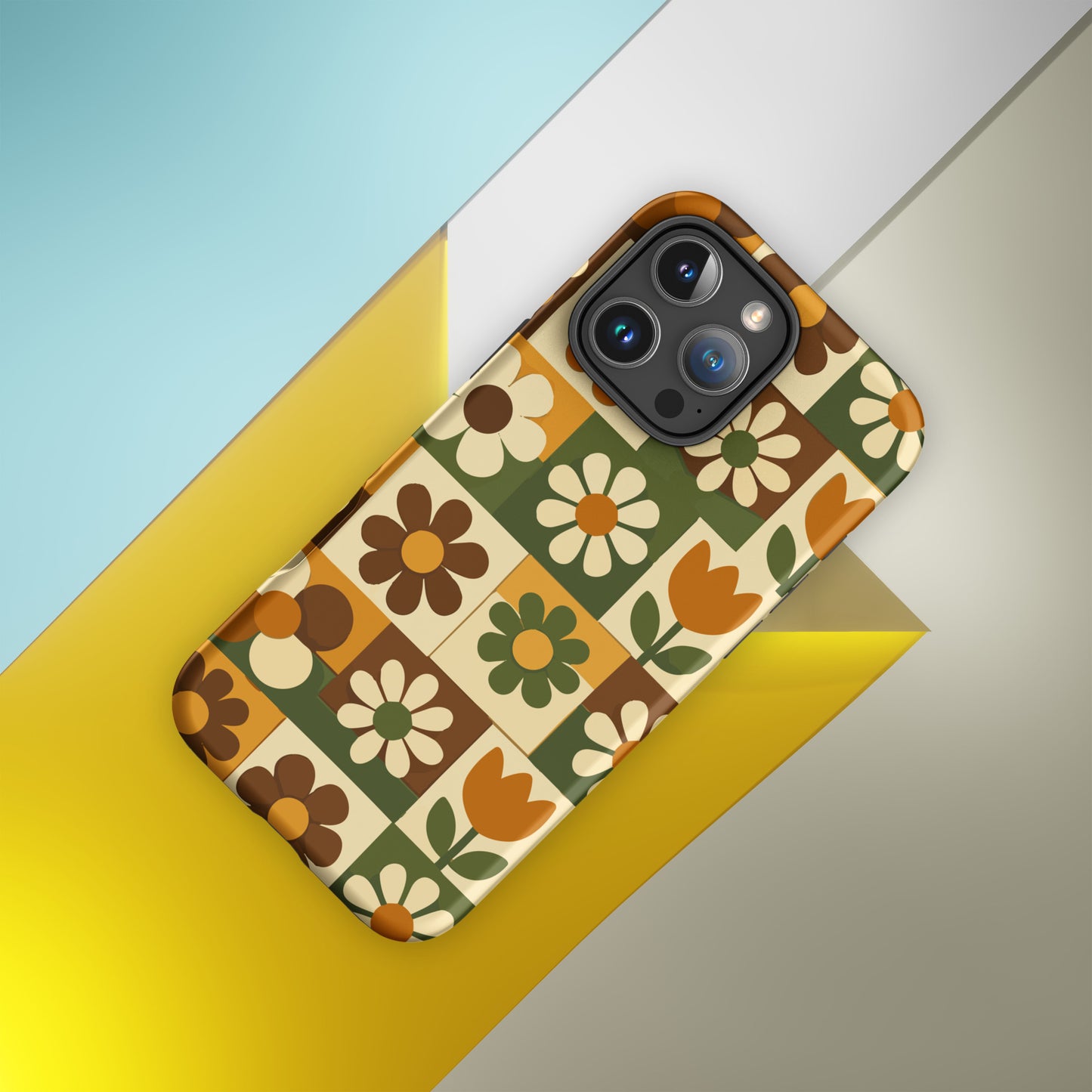 TPU iPhone case featuring a 1970s retro floral tile pattern in orange, brown, and green by Far Out Goods.