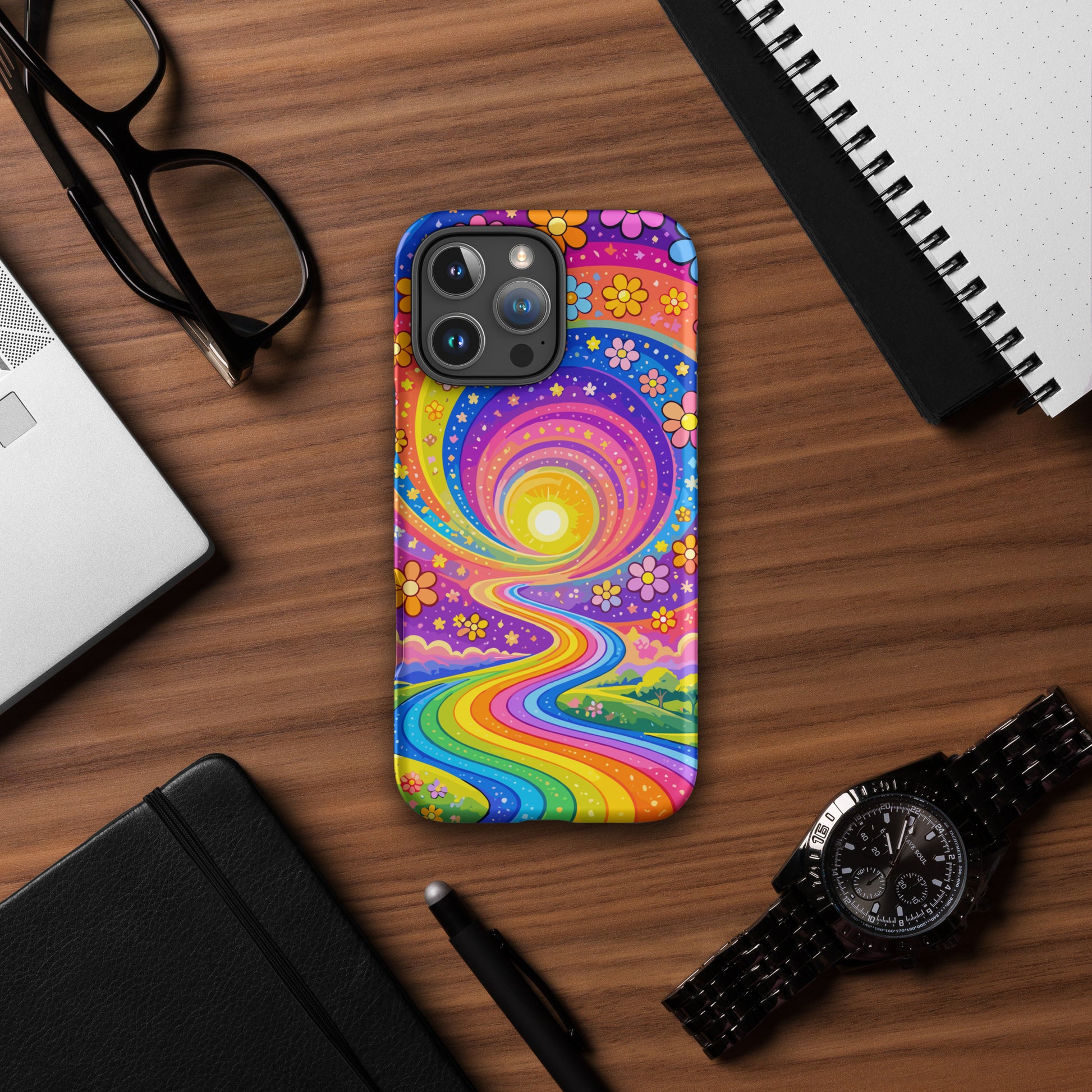 Psychedelic iPhone case featuring a vibrant rainbow road winding through green hills with colorful daisy flowers