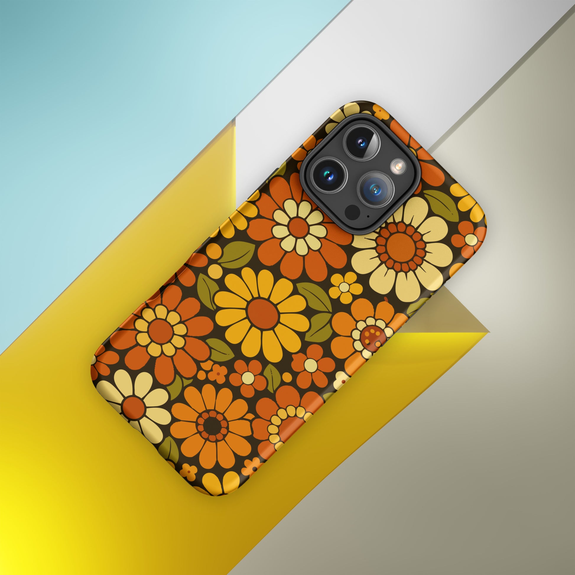 Retro 70s floral pattern with orange, yellow, and white daisies printed on a flexible clear TPU iPhone case.