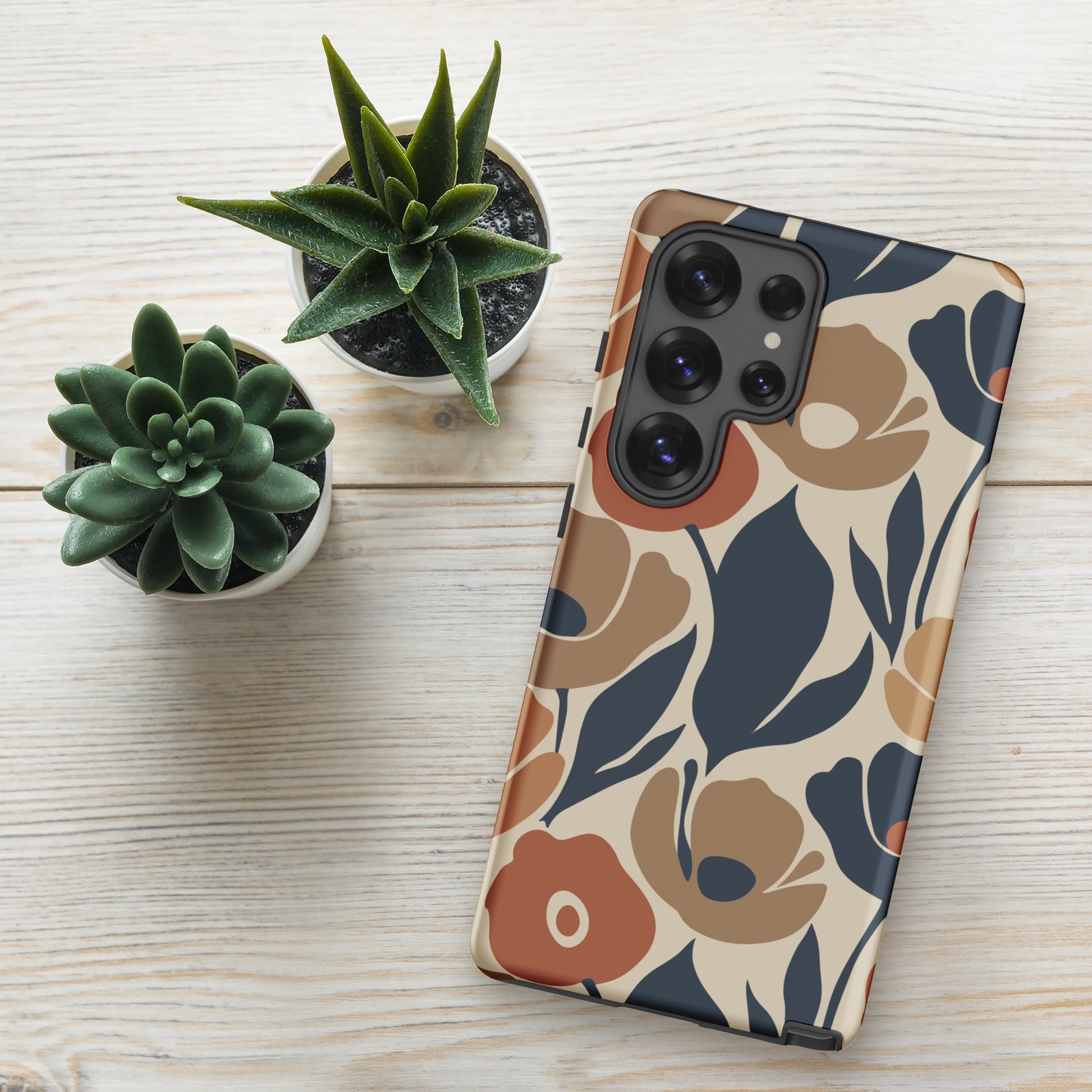 Protective TPU Samsung Galaxy case featuring a seamless retro floral print in terracotta, ochre, and deep navy blue.