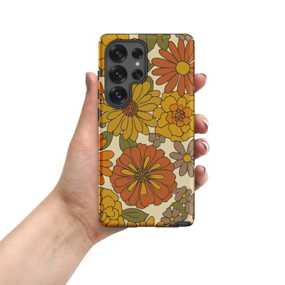 A flexible TPU Samsung Galaxy case featuring a seamless retro groovy floral pattern with warm orange and yellow daisies.
