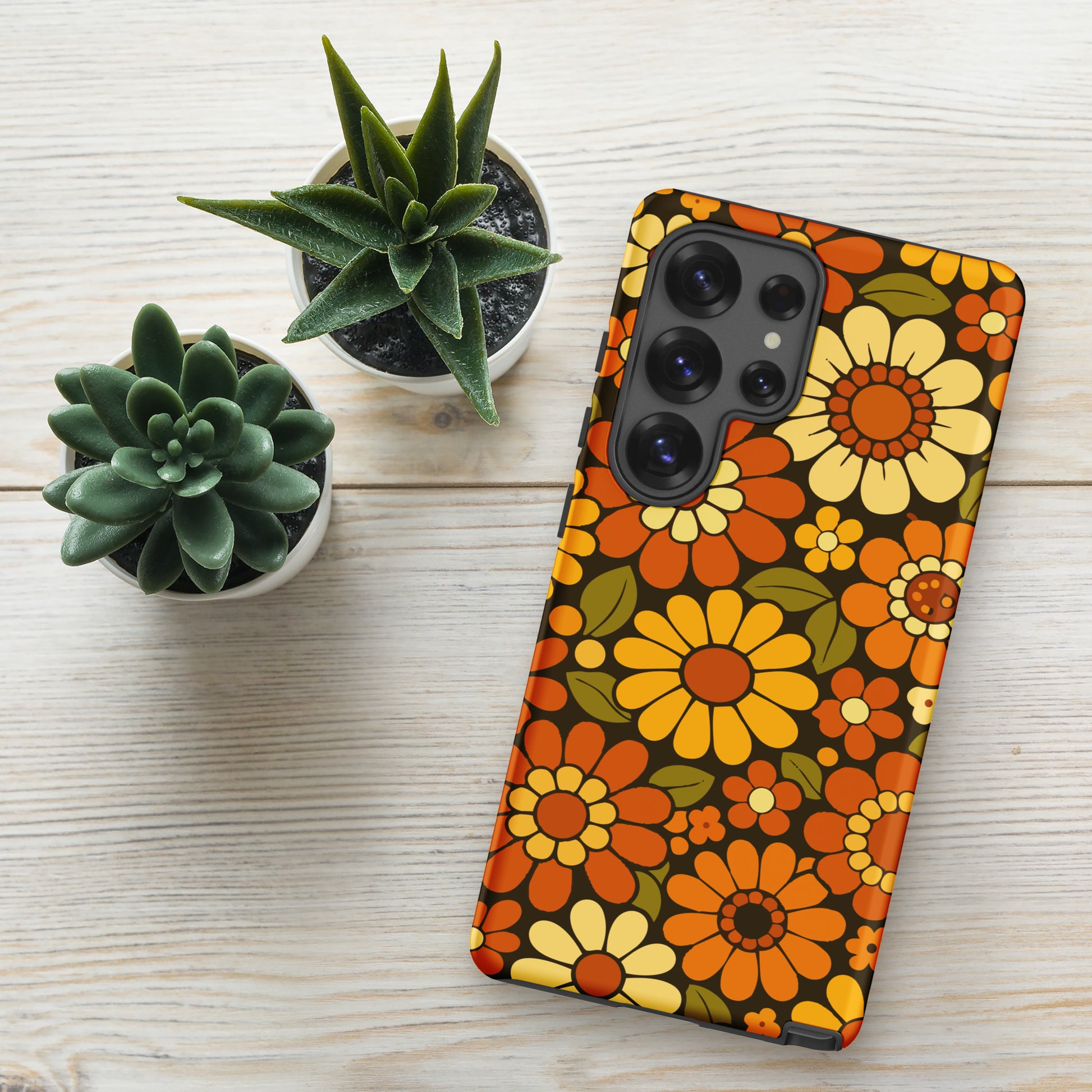 Retro 70s floral pattern with orange, yellow, and white daisies printed on a flexible clear TPU Samsung Galaxy case.