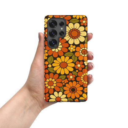 Retro 70s floral pattern with orange, yellow, and white daisies printed on a flexible clear TPU Samsung Galaxy case.
