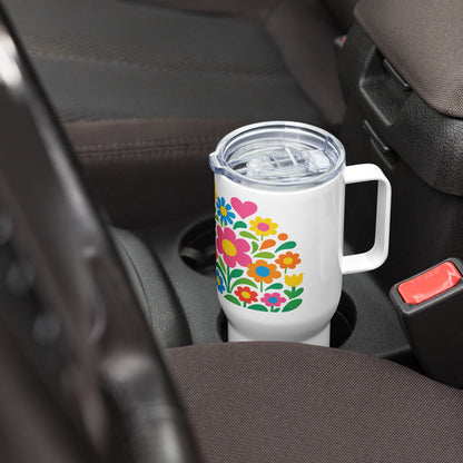 Vibrant 70s style retro flower power design with colorful daisies and hearts on a white stainless steel travel mug. faroutgoods