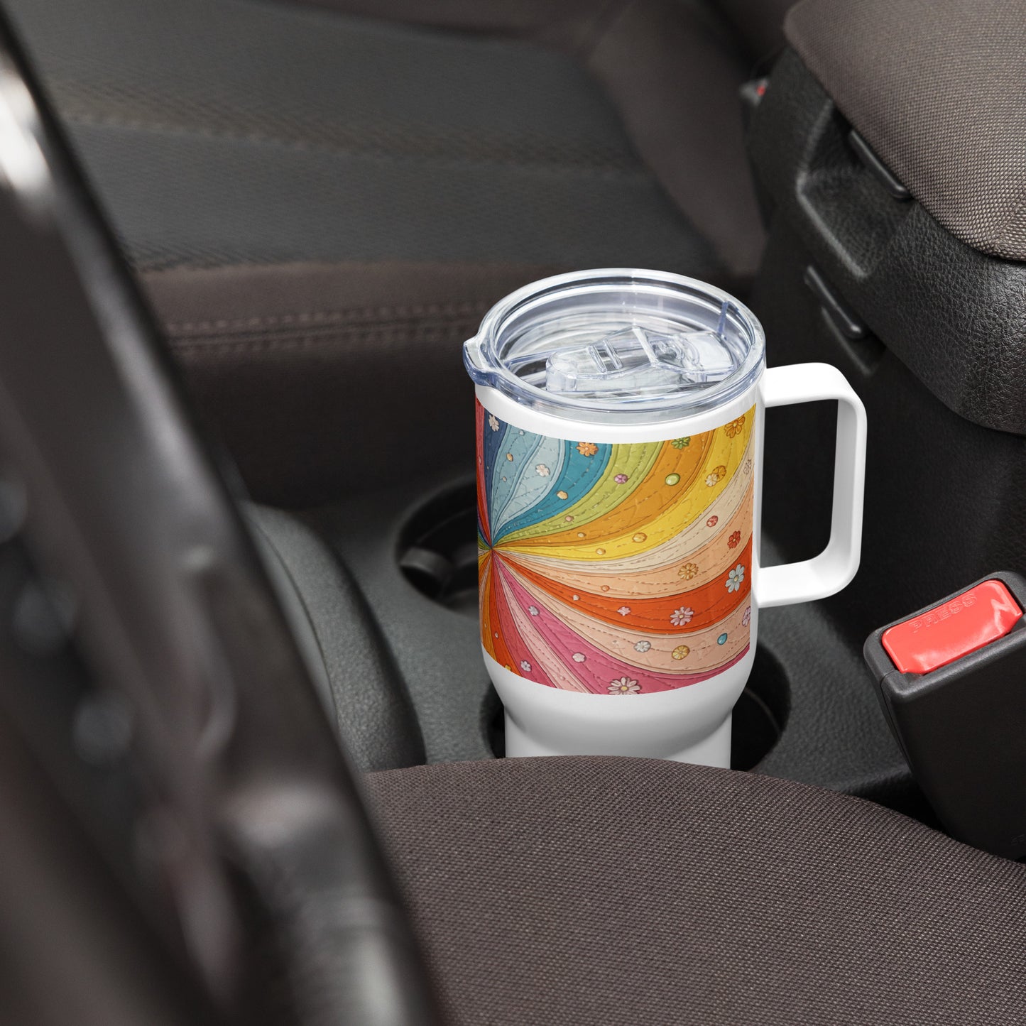 Stainless steel travel mug featuring a vibrant 70s retro quilted rainbow swirl design with stitched details and flowers.
