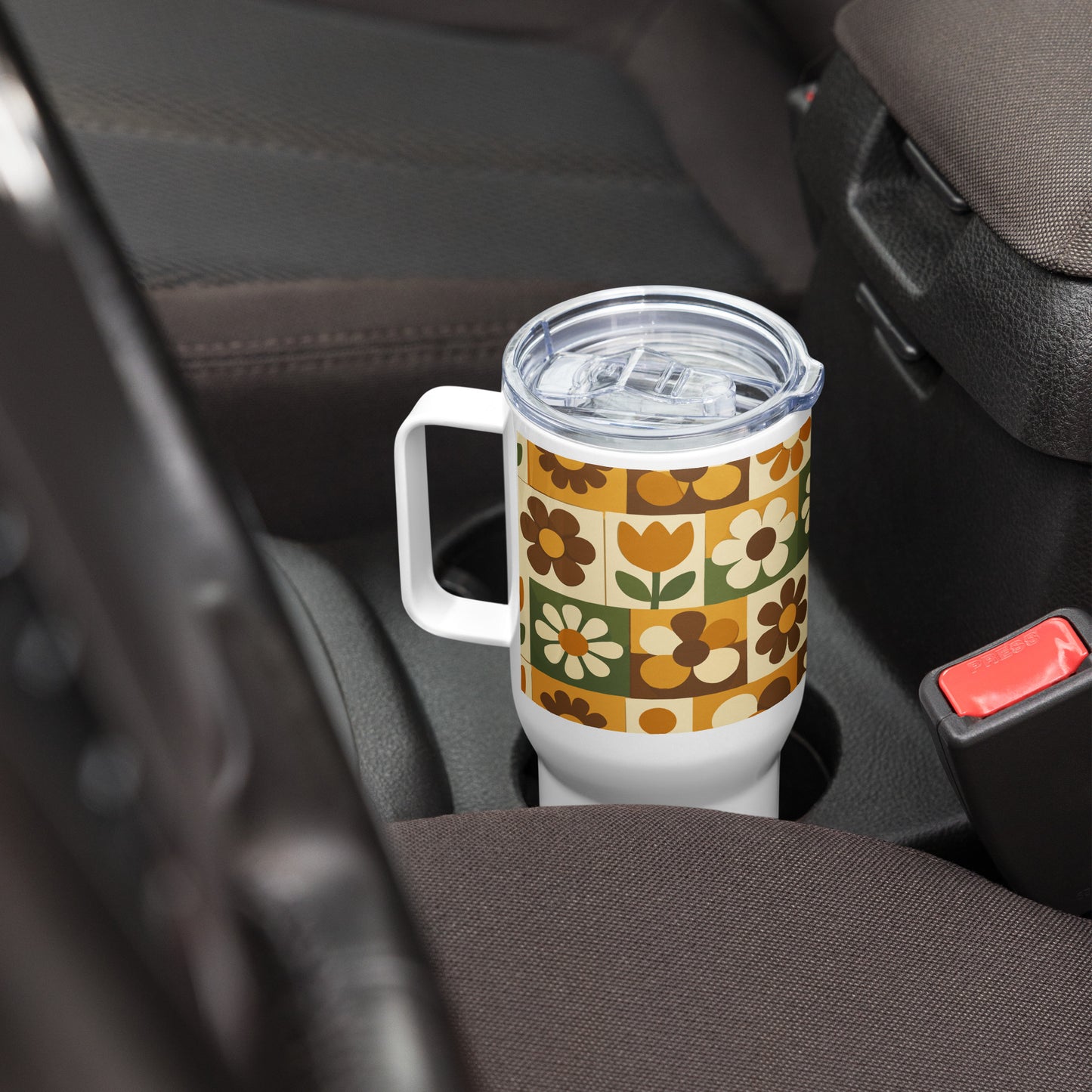 Stainless steel travel mug with a 1970s retro floral grid pattern of groovy flowers in orange, brown, and olive green.