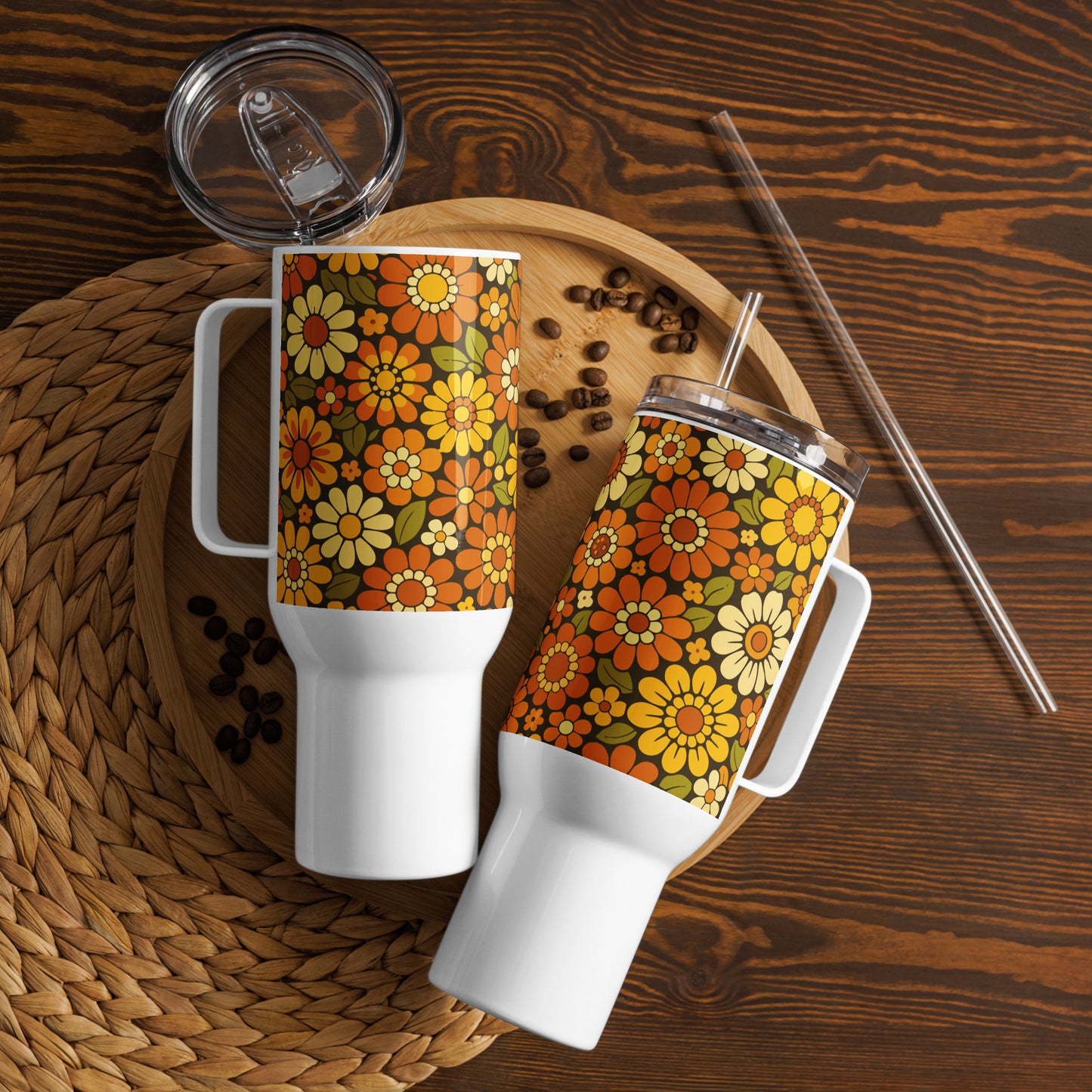 Retro 70s floral pattern stainless steel travel mug with orange, yellow, and cream daisies on a dark brown background.