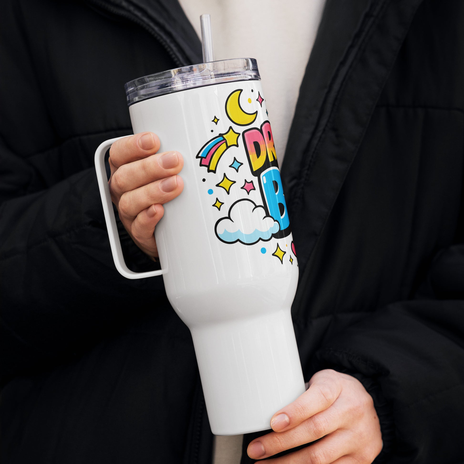Dream Big" cosmic design with colorful planets, stars, and clouds wrapped around a stainless steel travel tumbler.