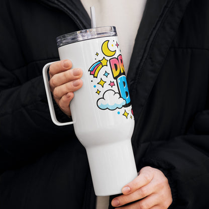 Dream Big" cosmic design with colorful planets, stars, and clouds wrapped around a stainless steel travel tumbler.