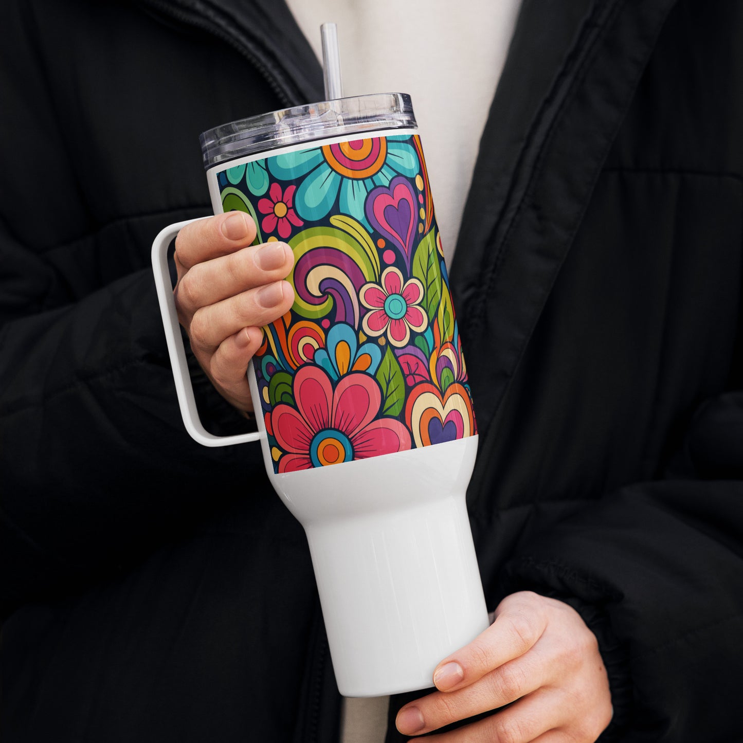 Stainless steel travel tumbler featuring a colorful 70s psychedelic pattern of groovy flowers, swirls, and hearts.