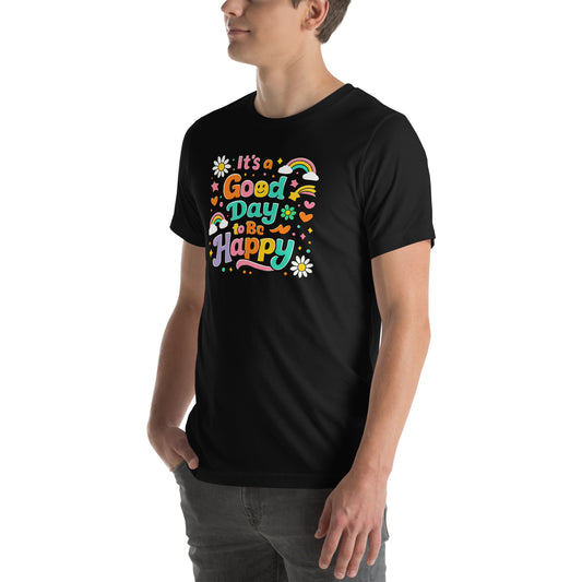 Colorful retro typography reading It’s a Good Day to Be Happy with rainbows, daisies, and stars on a black t-shirt.