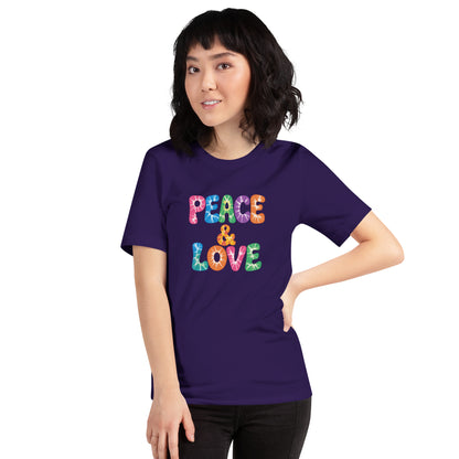 Retro tie-dye Peace and Love lettering printed on a classic black graphic t-shirt with vibrant 60s rainbow typography.