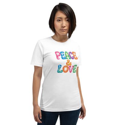 Retro tie-dye Peace and Love lettering printed on a classic black graphic t-shirt with vibrant 60s rainbow typography.