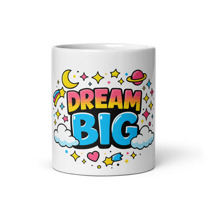 Vibrant "Dream Big" typography with a pink planet, yellow moon, and colorful stars on a black ceramic coffee mug.