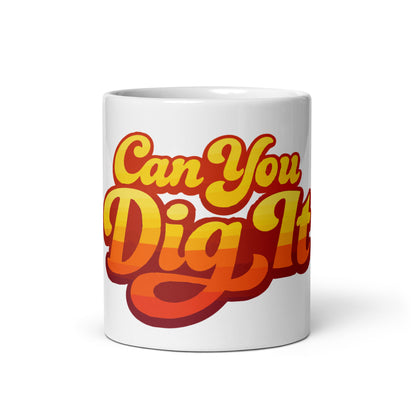 Retro sunset gradient typography reading Can You Dig It in bold orange and yellow groovy letters on a ceramic mug.