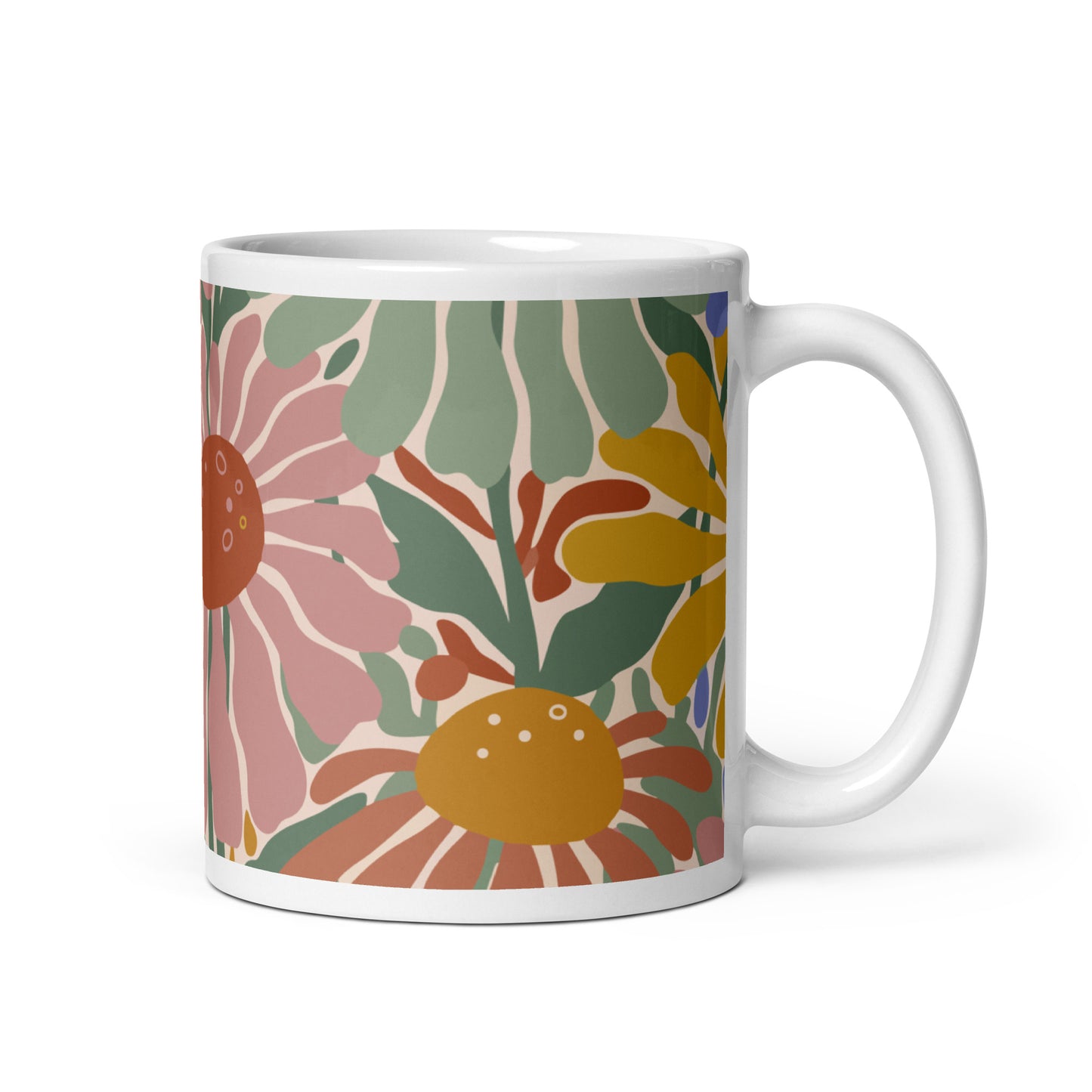 Retro 70s style flower power pattern with pink, green, and orange daisies on a bohemian ceramic coffee mug.
