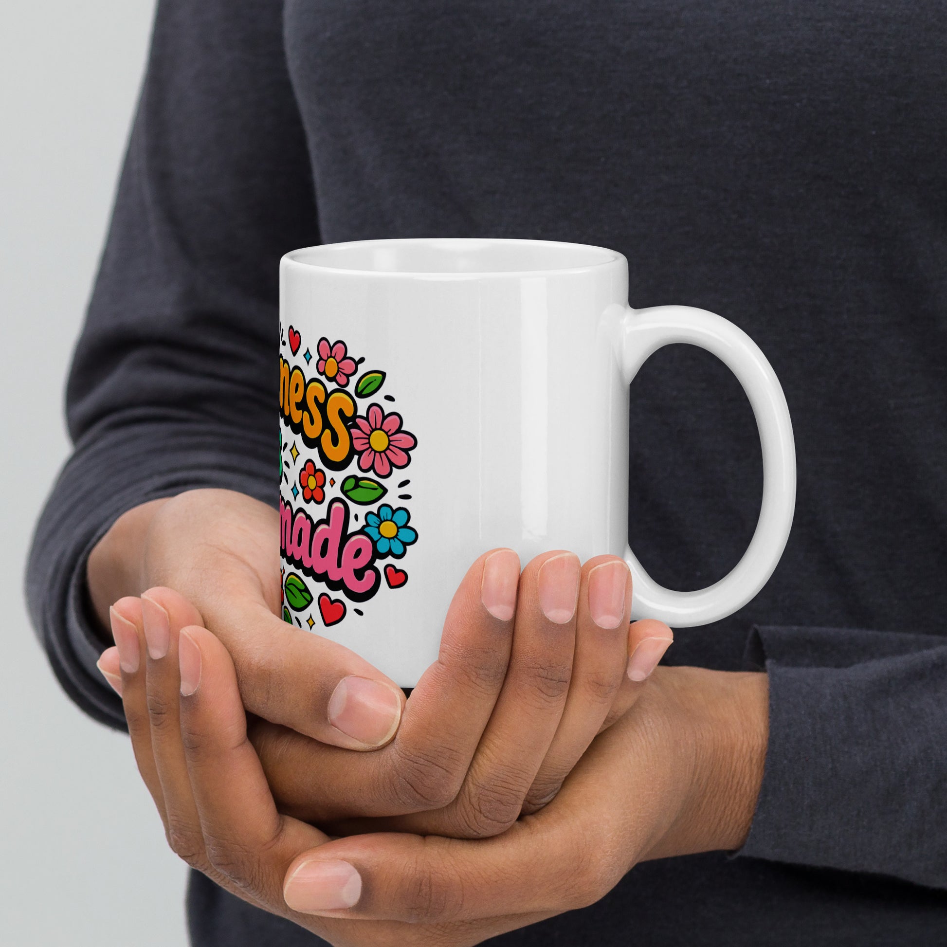 Retro coffee mug featuring 'Happiness is Homemade' text with 70s-style flowers and hearts on a black background.